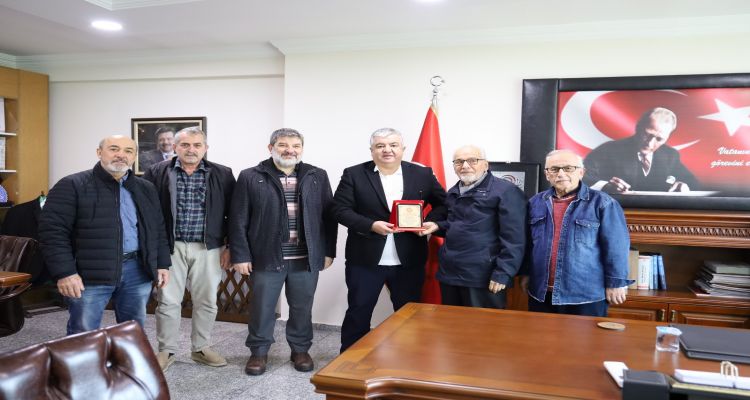 ÜNHADER'den Başkan Uslu'ya Teşekkür Plaketi: Sosyal ve Kültürel Faaliyetlere Destek Takdir Edildi